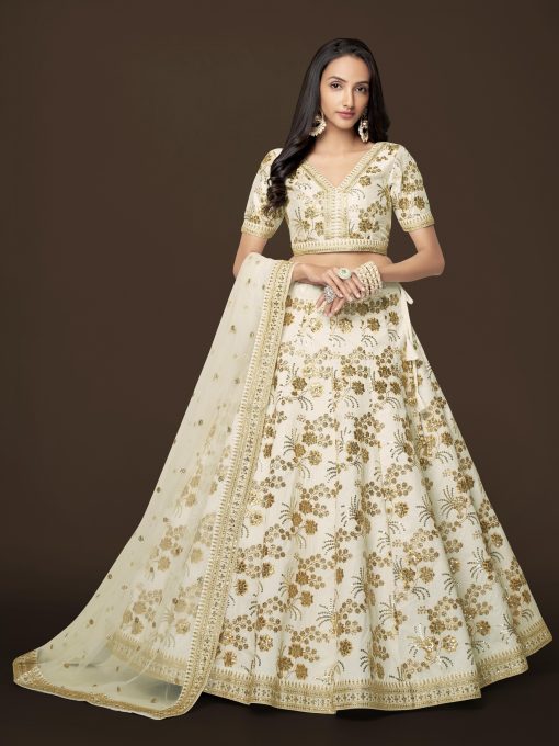 graceful white color lehenga made of slub silk material embellished with dori work, zari sequin work, and embroidery work