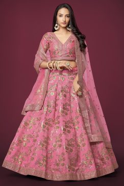 beautiful pink color lehenga made of slub silk material embellished with dori work, zari sequin work, and embroidery work