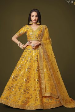 yellow lehenga arrives with a similar color slub silk material choli decorated with sequins work and zari work