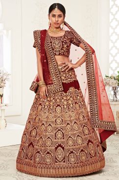 traditional lehenga in velvet material heavily embellishes with thread, zari, dori, and sequin embroidery work