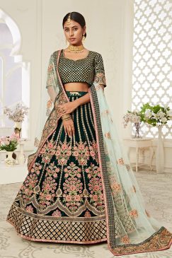 Lehenga in Dark Green Velvet richly crafted with Dori, Zari & Thread embroidery with Diamond work