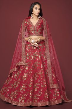 red color lehenga made of slub silk material decorated with dori work, zari sequin work, and embroidery work